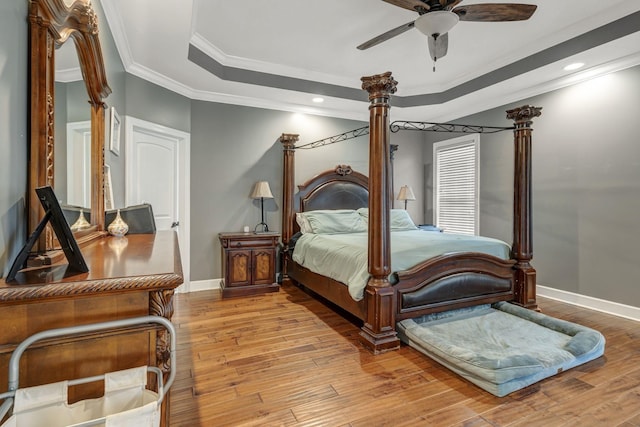 152 Camaro Dr, Chapmansboro, TN 37035 - bedroom with a raised ceiling, baseboards, ornamental molding, hardwood / wood-style floors, and ceiling fan