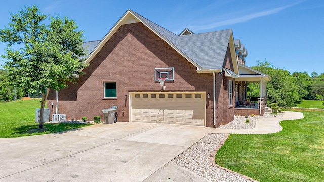 152 Camaro Dr, Chapmansboro, TN 37035 - view of property exterior with a yard, brick siding, concrete driveway, a porch, and roof with shingles
