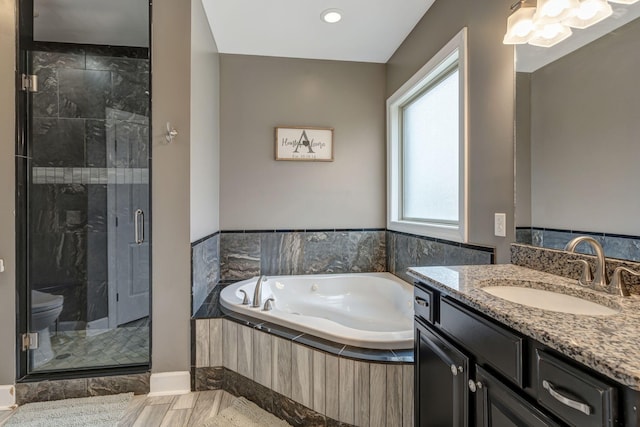 152 Camaro Dr, Chapmansboro, TN 37035 - bathroom with vanity, a bath, a shower stall, and toilet