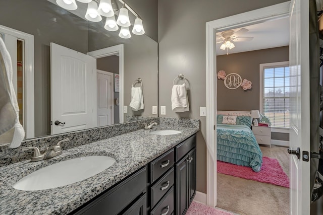 152 Camaro Dr, Chapmansboro, TN 37035 - ensuite bathroom featuring double vanity, a ceiling fan, and baseboards