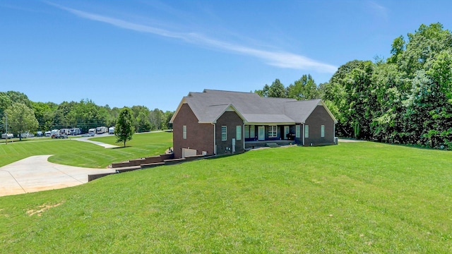 152 Camaro Dr, Chapmansboro, TN 37035 - ranch-style house with a front yard and an attached garage
