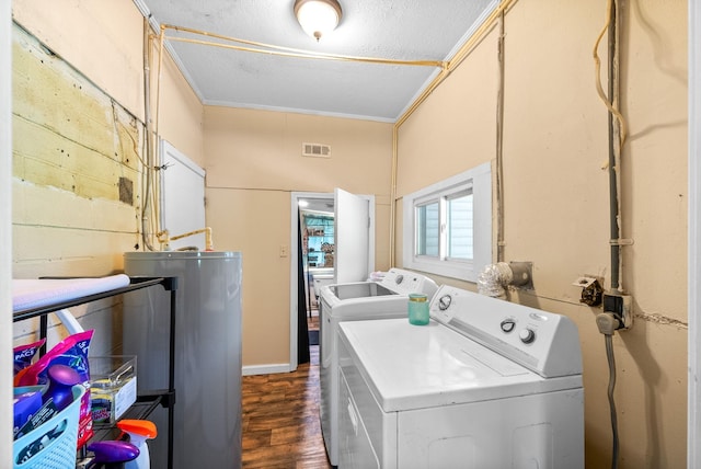 154 Crains Landing Rd, Dover, TN 37058 - laundry area with washing machine and dryer, dark wood-style flooring, water heater, and a textured ceiling
