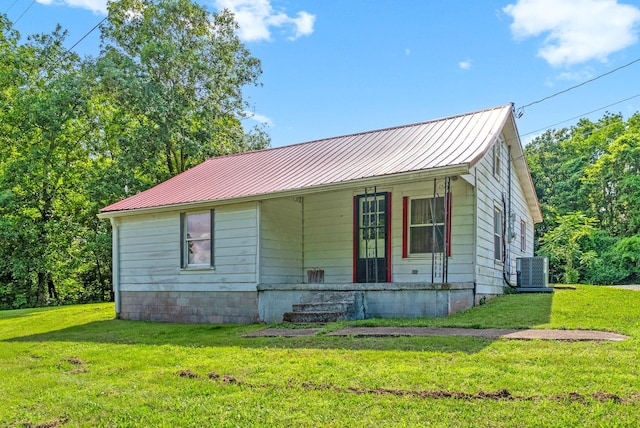 154 Crains Landing Rd, Dover, TN 37058 - view of front of property with a front lawn, metal roof, and central AC