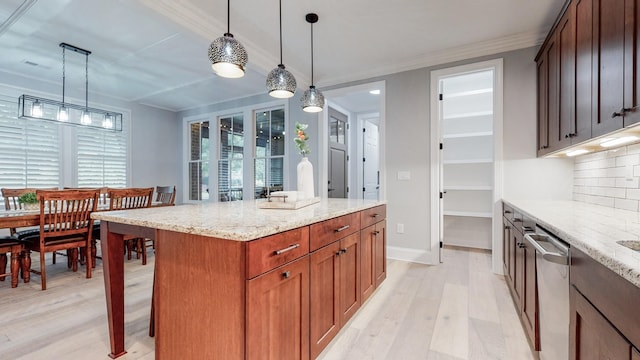 20 Daniels Dr, Franklin, TN 37064 - kitchen with stainless steel dishwasher, light wood-type flooring, ornamental molding, tasteful backsplash, and light stone counters
