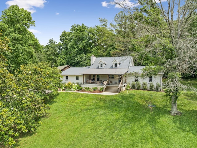 3348 Sweeney Hollow Rd, Franklin, TN 37064 - cape cod home with a porch, a chimney, a front yard, and a metal roof