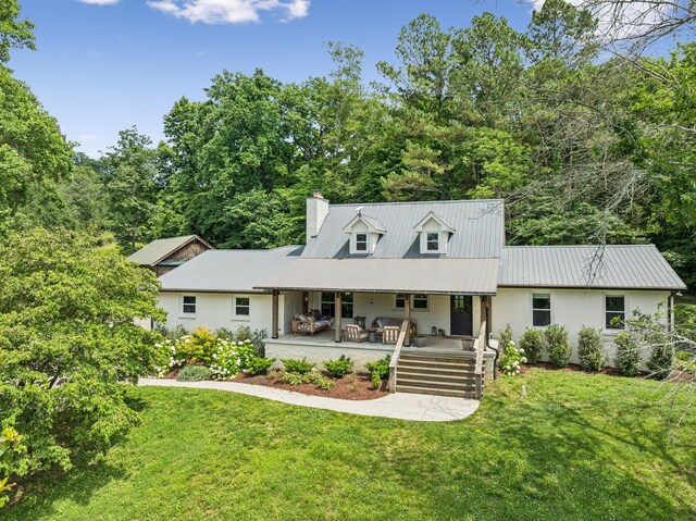 3348 Sweeney Hollow Rd, Franklin, TN 37064 - cape cod house with a front yard, a chimney, a metal roof, and covered porch