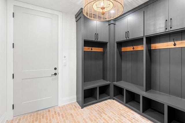 2915 Compton Rd, Nashville, TN 37215 - mudroom featuring brick floors, baseboards, and a chandelier