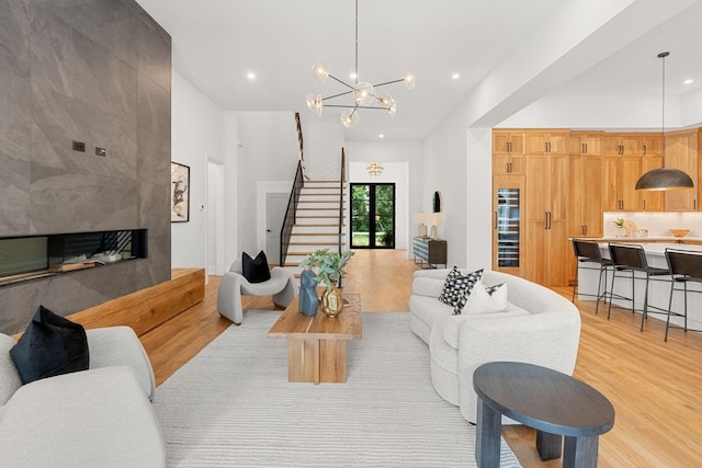 2915 Compton Rd, Nashville, TN 37215 - living room featuring light wood-style floors, stairs, recessed lighting, a chandelier, and a fireplace