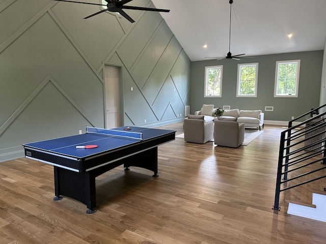 2915 Compton Rd, Nashville, TN 37215 - recreation room featuring a decorative wall, a ceiling fan, plenty of natural light, vaulted ceiling, and wood finished floors