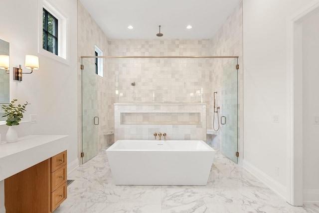 2915 Compton Rd, Nashville, TN 37215 - bathroom featuring vanity, a soaking tub, a stall shower, marble finish flooring, and baseboards