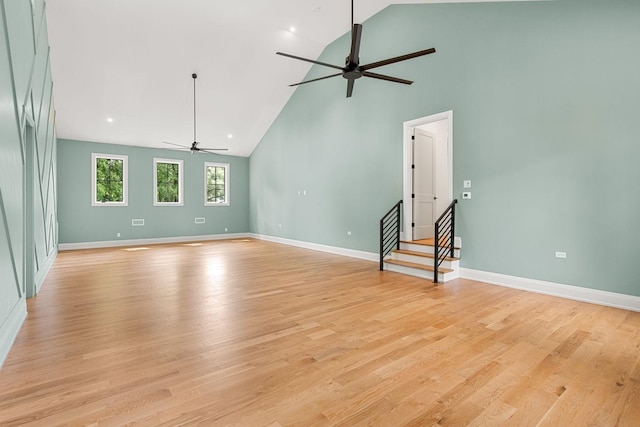 2915 Compton Rd, Nashville, TN 37215 - unfurnished living room with ceiling fan, high vaulted ceiling, light wood finished floors, and baseboards