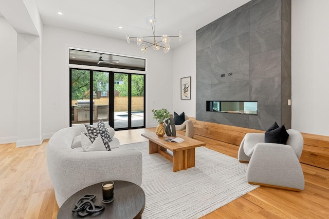 2915 Compton Rd, Nashville, TN 37215 - living room featuring light wood-style floors, baseboards, a chandelier, a multi sided fireplace, and recessed lighting