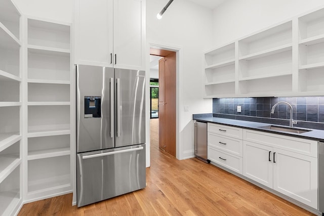 2915 Compton Rd, Nashville, TN 37215 - kitchen with stainless steel refrigerator with ice dispenser, a sink, open shelves, dark countertops, and white cabinetry