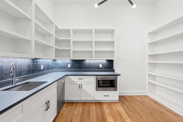 2915 Compton Rd, Nashville, TN 37215 - kitchen with open shelves, a sink, stainless steel appliances, and backsplash