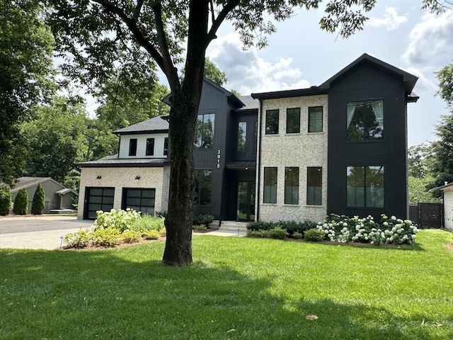 2915 Compton Rd, Nashville, TN 37215 - contemporary home with a front yard, an attached garage, driveway, and brick siding