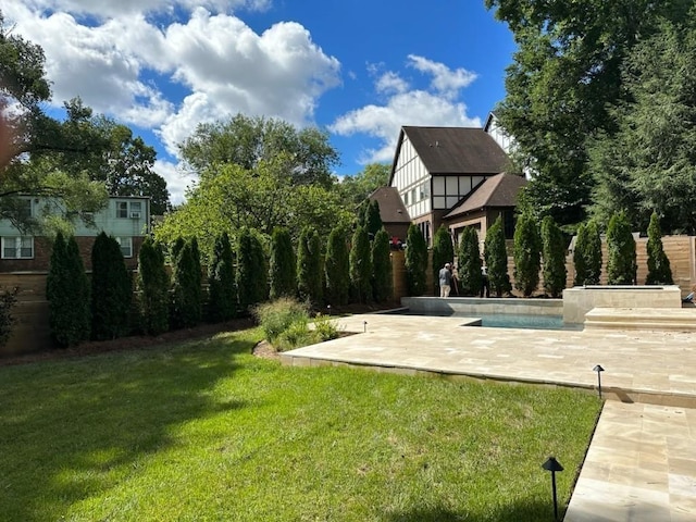 2915 Compton Rd, Nashville, TN 37215 - view of grassy yard with a patio area and an outdoor pool
