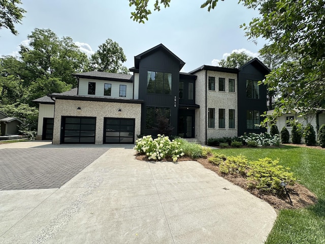 2915 Compton Rd, Nashville, TN 37215 - modern home with driveway, an attached garage, and brick siding