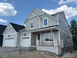 1040 Cherry Tree Dr, Mount Juliet, TN 37122 - craftsman inspired home with covered porch, driveway, and board and batten siding