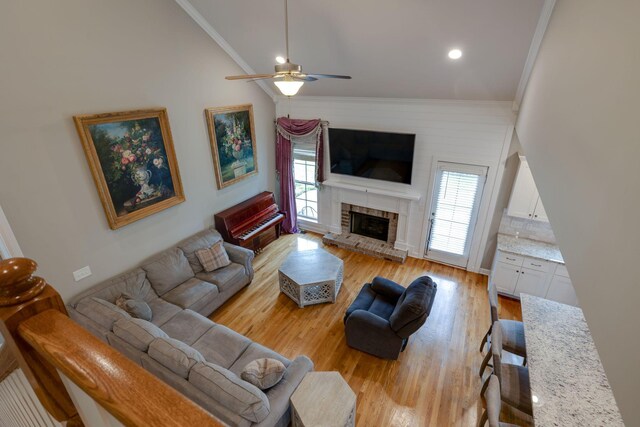2001 Katach Ct, Spring Hill, TN 37174 - living area featuring crown molding, ceiling fan, healthy amount of natural light, vaulted ceiling, and light wood-type flooring