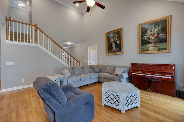2001 Katach Ct, Spring Hill, TN 37174 - living room featuring ceiling fan, ornamental molding, stairs, wood finished floors, and a high ceiling