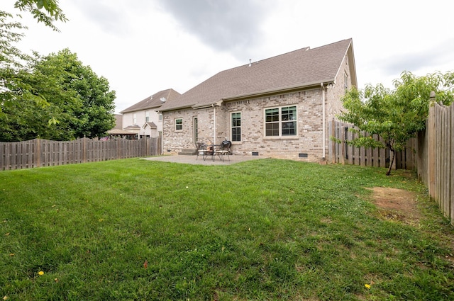 2001 Katach Ct, Spring Hill, TN 37174 - back of house featuring crawl space, brick siding, a patio, and a fenced backyard