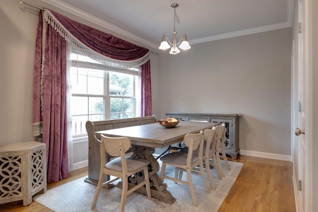 2001 Katach Ct, Spring Hill, TN 37174 - dining space with light wood-type flooring, crown molding, and a chandelier