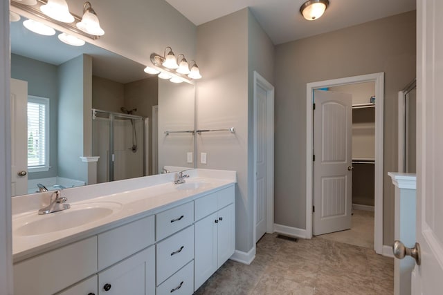 2001 Katach Ct, Spring Hill, TN 37174 - bathroom with a stall shower, double vanity, and a walk in closet
