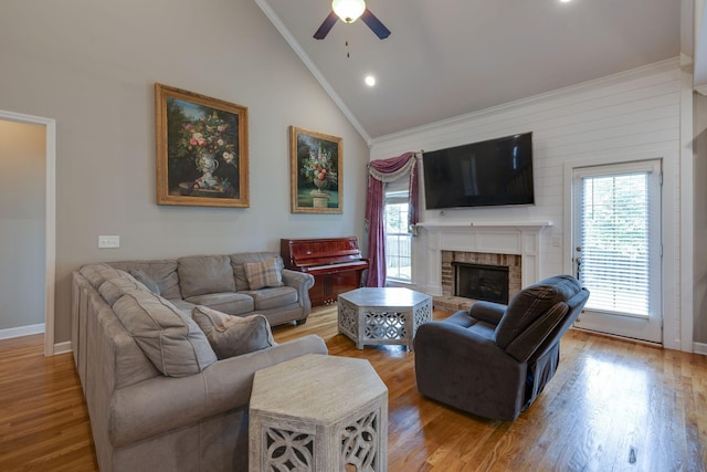 2001 Katach Ct, Spring Hill, TN 37174 - living area with vaulted ceiling, ornamental molding, a ceiling fan, a fireplace, and wood finished floors