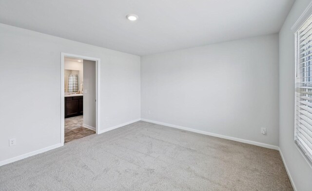 1013 Pepper Stone Dr, Lebanon, TN 37087 - unfurnished bedroom featuring carpet, connected bathroom, and recessed lighting