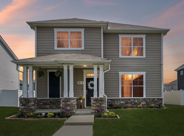 1013 Pepper Stone Dr, Lebanon, TN 37087 - view of front facade featuring covered porch, stone siding, and a shingled roof