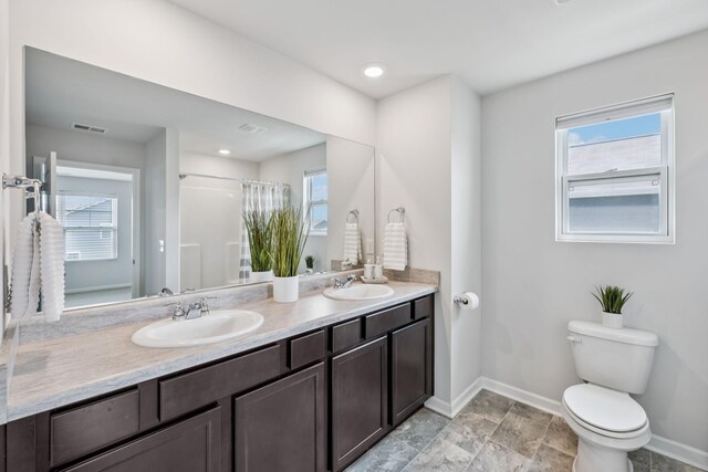 1013 Pepper Stone Dr, Lebanon, TN 37087 - bathroom featuring double vanity and curtained shower
