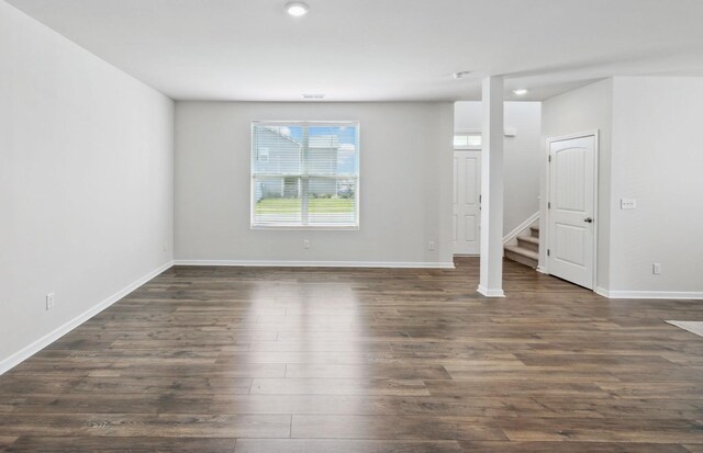 1013 Pepper Stone Dr, Lebanon, TN 37087 - empty room featuring dark wood-style flooring and stairs