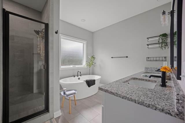 276 Indian Creek Rd, Cumberland Furnace, TN 37051 - bathroom with a stall shower, a freestanding tub, vanity, and tile patterned flooring