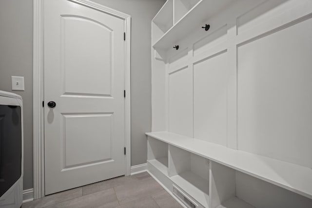 276 Indian Creek Rd, Cumberland Furnace, TN 37051 - mudroom featuring baseboards, washer / clothes dryer, and light tile patterned floors