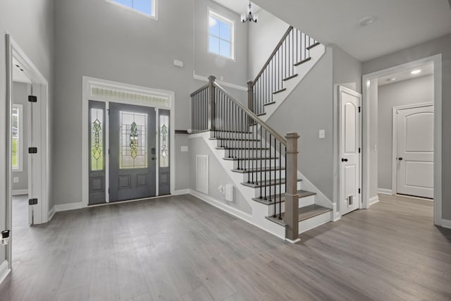 276 Indian Creek Rd, Cumberland Furnace, TN 37051 - entrance foyer with wood finished floors, stairs, a high ceiling, and baseboards