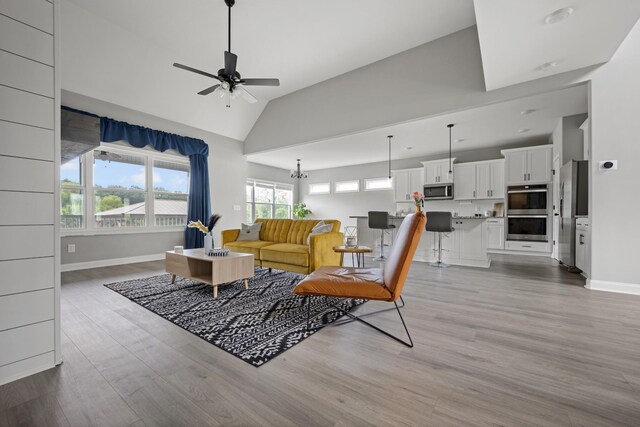 276 Indian Creek Rd, Cumberland Furnace, TN 37051 - living area featuring ceiling fan, wood finished floors, baseboards, and high vaulted ceiling