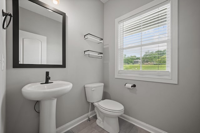276 Indian Creek Rd, Cumberland Furnace, TN 37051 - half bath with baseboards, toilet, a sink, and tile patterned floors