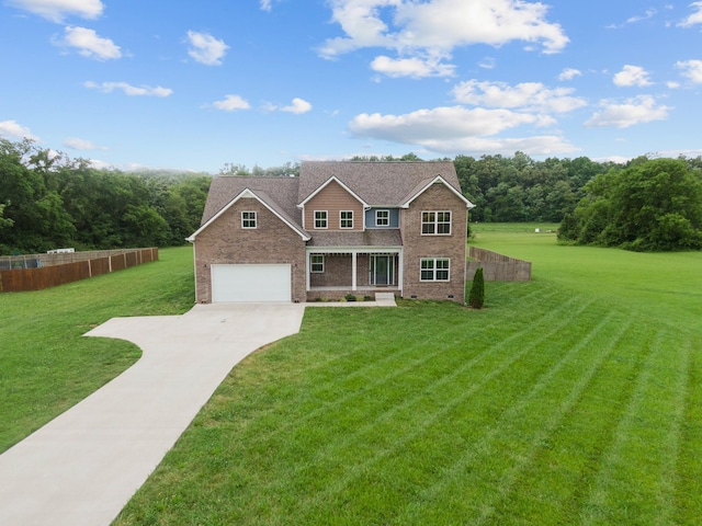 276 Indian Creek Rd, Cumberland Furnace, TN 37051 - view of front of house featuring concrete driveway, brick siding, and roof with shingles