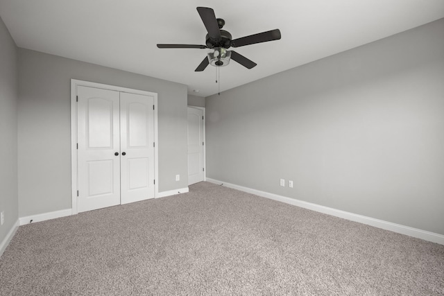 276 Indian Creek Rd, Cumberland Furnace, TN 37051 - unfurnished bedroom with carpet, a closet, baseboards, and a ceiling fan