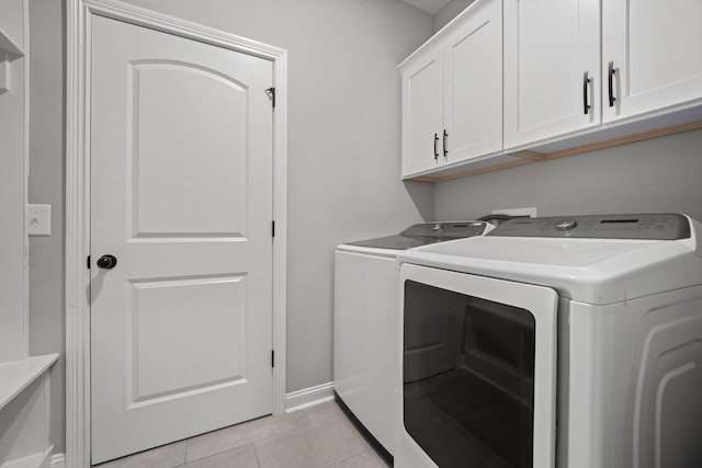 276 Indian Creek Rd, Cumberland Furnace, TN 37051 - laundry room with washer and dryer, cabinet space, light tile patterned flooring, and baseboards