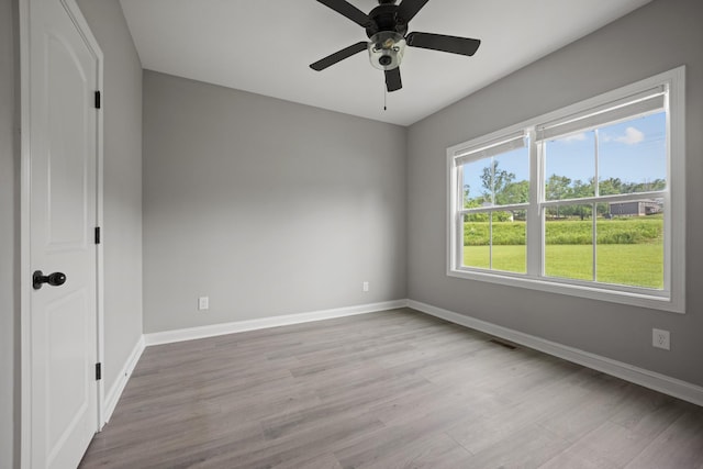 276 Indian Creek Rd, Cumberland Furnace, TN 37051 - spare room featuring baseboards, wood finished floors, and ceiling fan