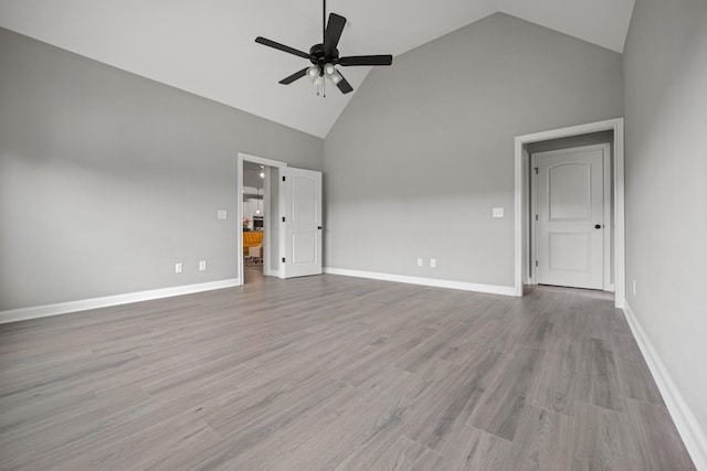 276 Indian Creek Rd, Cumberland Furnace, TN 37051 - empty room featuring ceiling fan, high vaulted ceiling, wood finished floors, and baseboards