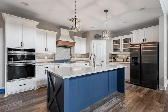 6400 Williams Rd, Cross Plains, TN 37049 - kitchen featuring fridge with ice dispenser, custom range hood, a sink, a chandelier, and dark wood finished floors
