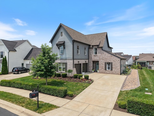 27 Yearling Way, Mount Juliet, TN 37122 - view of front of home with brick siding, driveway, an attached garage, a front yard, and a residential view