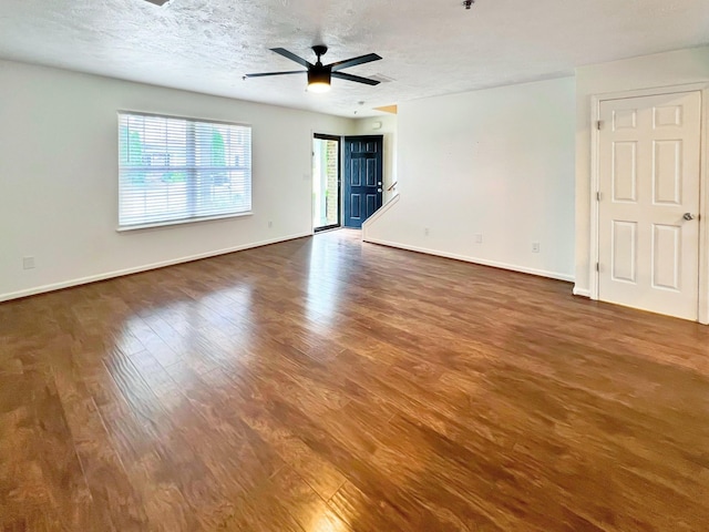 4017 Pavati Trce, Spring Hill, TN 37174 - empty room featuring dark wood finished floors, baseboards, a ceiling fan, and a textured ceiling