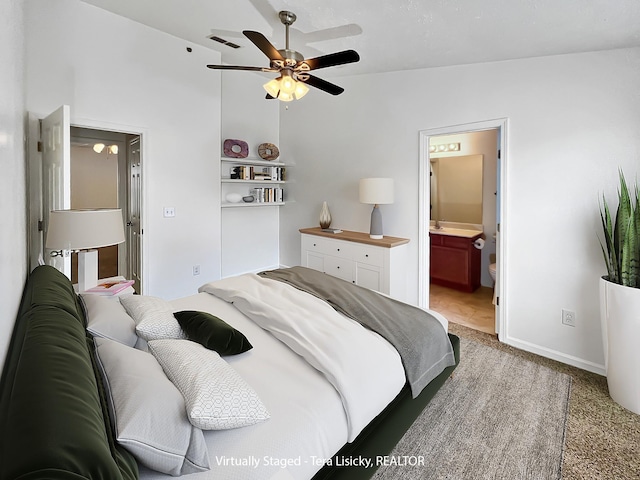 4017 Pavati Trce, Spring Hill, TN 37174 - bedroom featuring lofted ceiling, light carpet, baseboards, ensuite bathroom, and ceiling fan