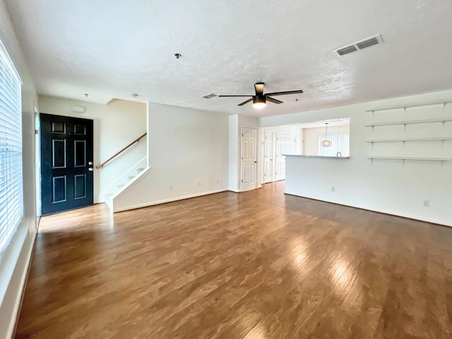 4017 Pavati Trce, Spring Hill, TN 37174 - unfurnished living room featuring wood finished floors, healthy amount of natural light, a ceiling fan, and baseboards