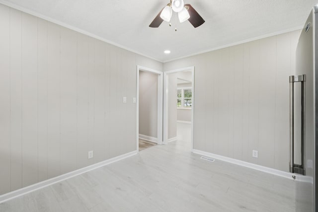 2762 Hunters Point Pike, Lebanon, TN 37087 - unfurnished room with ornamental molding, a ceiling fan, light wood-style flooring, and a textured ceiling