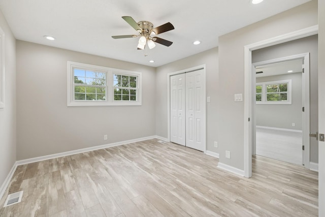 2762 Hunters Point Pike, Lebanon, TN 37087 - unfurnished bedroom with multiple windows, light wood-type flooring, a closet, and recessed lighting