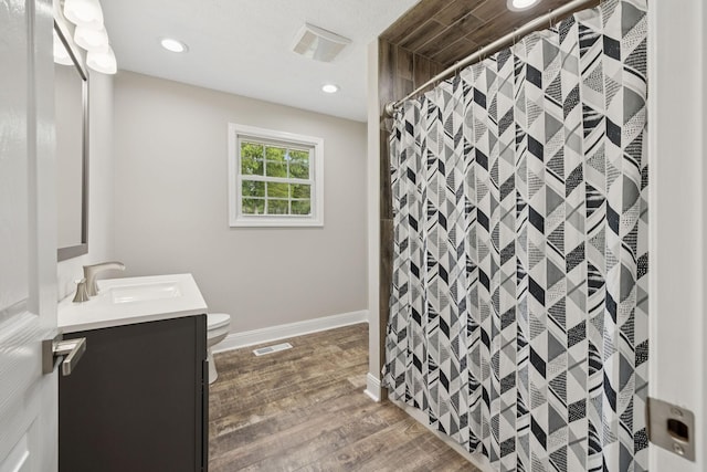 2762 Hunters Point Pike, Lebanon, TN 37087 - full bathroom featuring vanity, wood finished floors, curtained shower, and recessed lighting